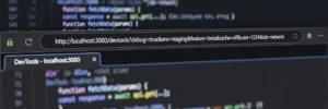 Browser address bar showing a URL with a question mark and query string parameters on a developer's monitor